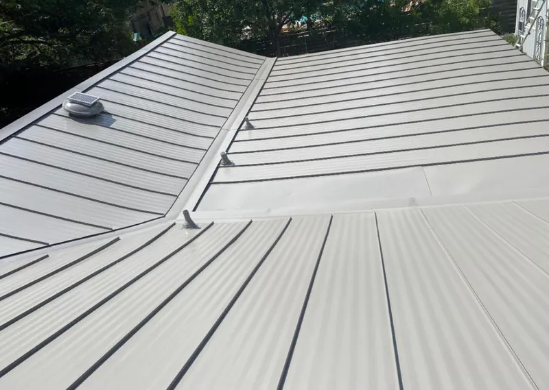 Solar attic fan installed on a metal roof for Roof Ventilation in Orinda